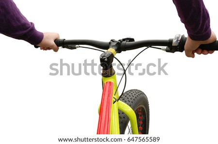 Steering wheel of a bicycle. Hands with the wheel of a bicycle on an isolated background