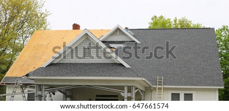 new roof under construction Royalty-Free Stock Photo #647661574