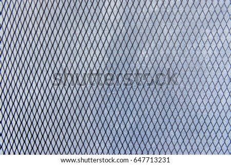 Texture the cage metal net on cement wall