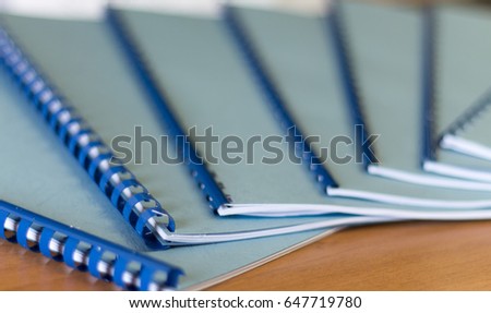 Nice blue handbooks on office desk Royalty-Free Stock Photo #647719780