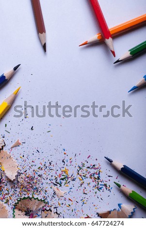 Colored pencils on white paper, back to school concept