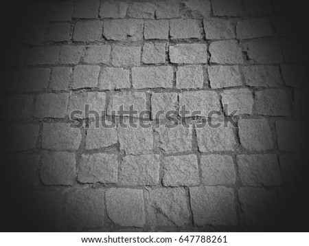 Stone pavement road black and white background in vignette