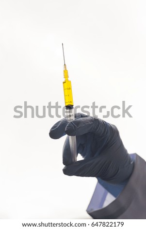 Close Up, The doctor holds the vaccine syringe