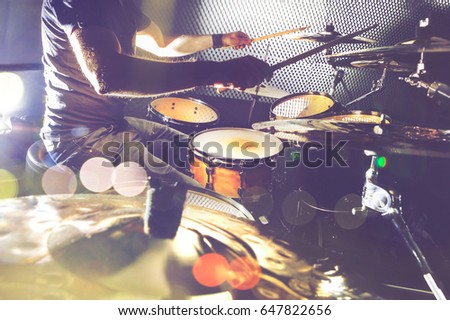 Live music background in vintage style.Drum kit on stage and lights