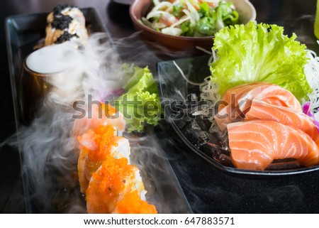 Set Of Salmon Menu Served On Black Plate, stock photo