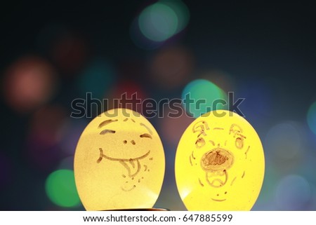 2 transparency smile egg shells  and many color bokeh