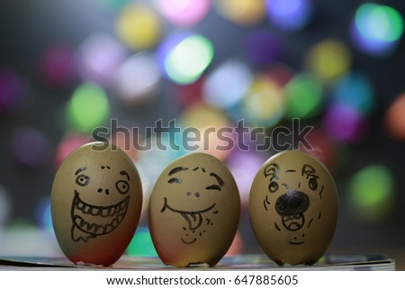 laugh smile  and doubt faces on 3 egg shells