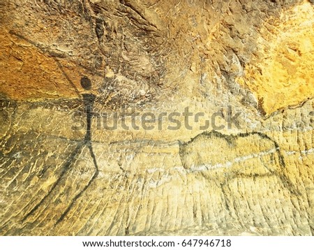 Buffalo hunting. Paint of human hunting on sandstone wall, prehistoric picture. Black carbon abstract children art in sandstone cave. Spotlight shines on caveman painting in cave