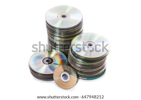 Heap of old used cd  and mini disks. Isolated over white background 