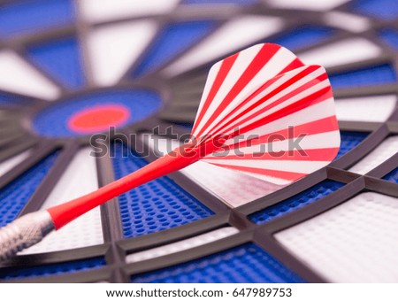  Dartboard with one red dart 