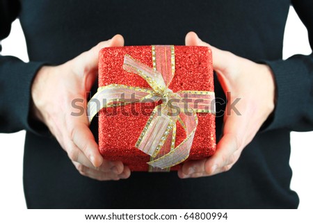 Man wearing black shirt holding a christmas gift box