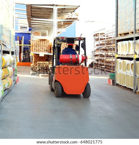 Stacking truck in wholesale warehouse