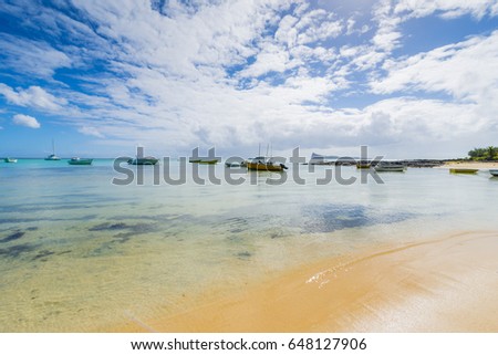 Mauritius - Bain Boeuf tropical beach with Coin de Mire Island in background
