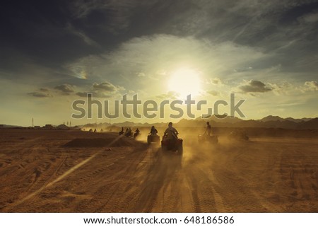 Group of tourist  on ATVs on Egyptian desert. Colored, reworked
 Royalty-Free Stock Photo #648186586