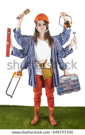 Smart girl in a white T-shirt with six hands standing on the green grass and holding building tools. Building concept with many hand. White background. 