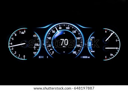 Modern light car mileage (dashboard, milage) isolated on a black background. New display of a modern car. RPM, Fuel indicator and temperature. 70 mph. Royalty-Free Stock Photo #648197887
