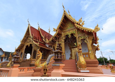 Beautiful Golden Church and Sanctuary in Thai Public Temple at Chiangmai Province, Thailand with Blue Sky.