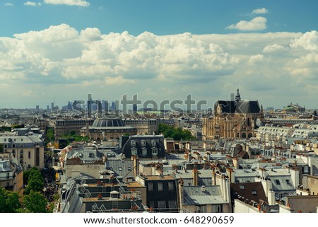 Paris rooftop view with city skyline.