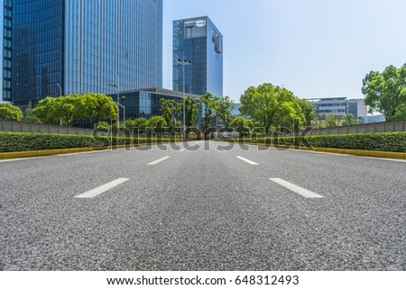 city road through modern buildings in beijing
