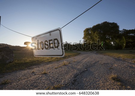 CLOSED: Sign hanging across a road