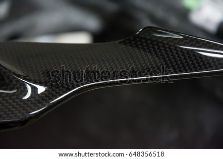 Carbon fiber product with dark tone background