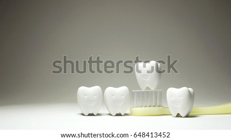 Group of Tooth model smile on Yellow Toothbrush 