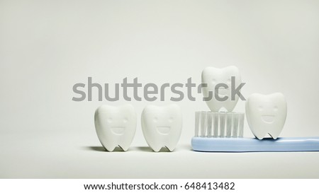 Group of Tooth model smile on Blue Toothbrush in white background