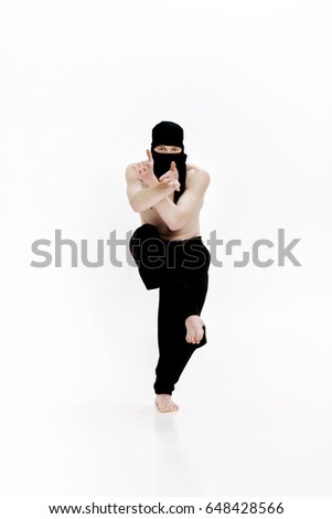 Ninja on white background. Male fighter in black clothes