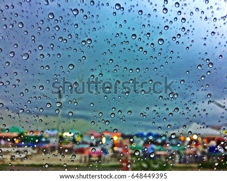 Blur picture HRD photo of water drop on glass,raining season concept