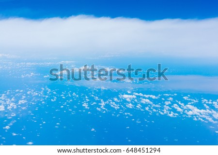 Skyline View above the clouds from air plane. blue