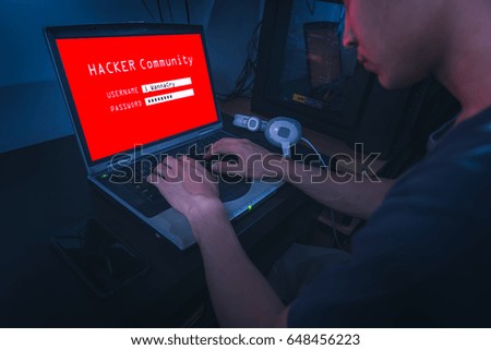 The hackers try to illegally login with his laptop. Hackers try to enter the social system for connecting to another hacker. the concept of hacking and cyber attacking.