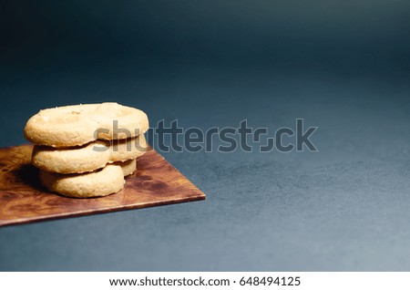 Cookies on wooden plate and blur background
