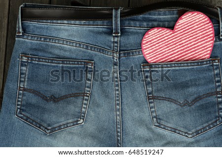 Valentine's day background with heart in jeans' pocket