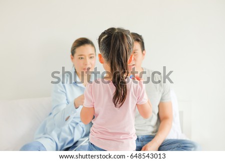 Daughter is be scolding by her parents Royalty-Free Stock Photo #648543013