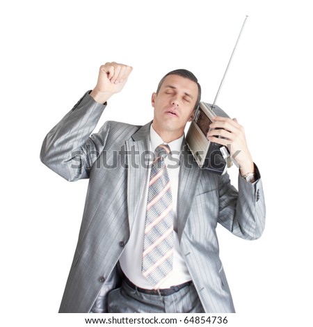 The adult man listens to a favourite musical melody and dances
