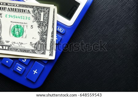 The currency banknote put on the calculator represent the business finance concept related idea.