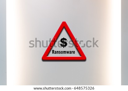 Network security concept - Text Ransomware  on  Warning Triangular.