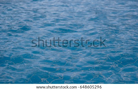 surface of blue swimming pool,background of water in swimming pool / soft focus picture 