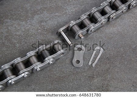 Industrial driving roller chain. Part of the chain drive of machine-building mechanism