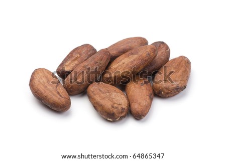Pile of cocoa beans on white. Shallow depth of field. Royalty-Free Stock Photo #64865347