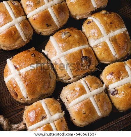 Hot cross buns in wooden tray. Close up. Top view. Easter baking. Square image