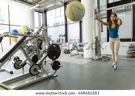 Beautiful woman training in gym