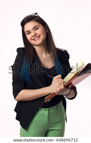 Beautiful brunette student girl in black jacket with papers