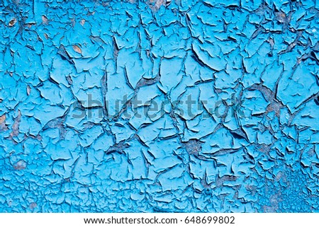 Blue wall. Cracks in the paint. background