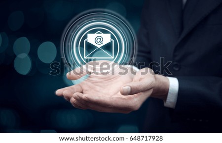 young businessman hand flying virtual email icon