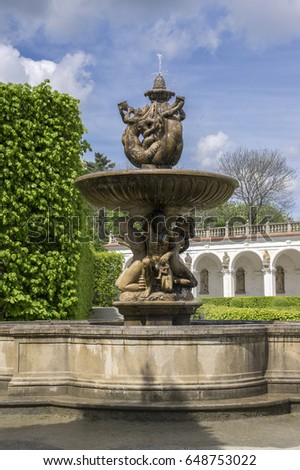 Flower gardens in french style, fountain, fountain and colonnade building in Kromeriz, Czech republic, Europe