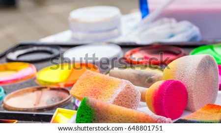 Color cosmetics, brushes and sponges for face painting. Children party