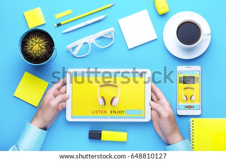 Man holding tablet in hand. Digital technology. Innovative implementation in business. Internet applications. Tablet phone and camera. Developing applications on the Internet. Flat lay photo