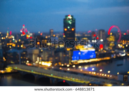 London at night, view at River thames embankment and London bridge. Blurred image