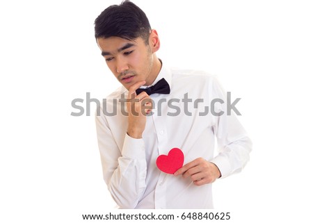 Young man holding a read heart 